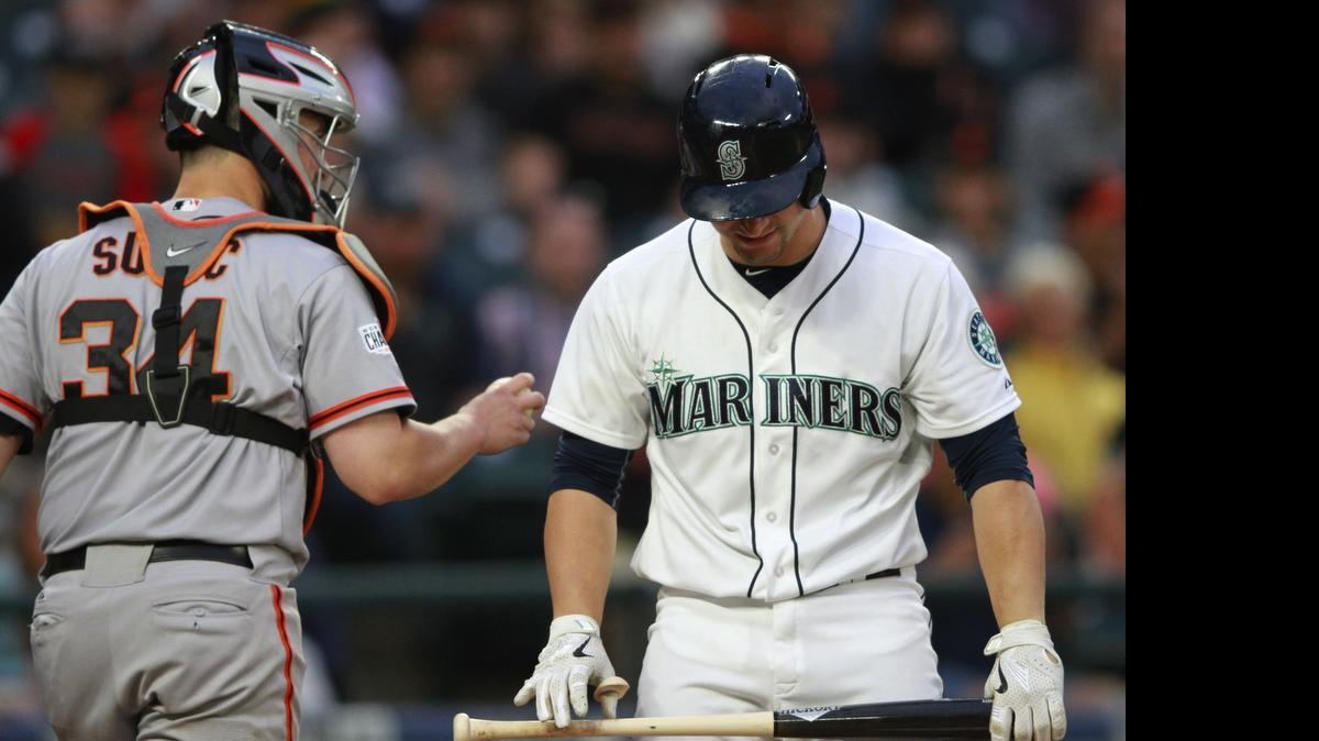 
Seattle’s Mike Zunino, right, and Giants catcher Andrew Susac head to their respective dugouts after Zunino struck out to end the fifth inning Thursday. 
