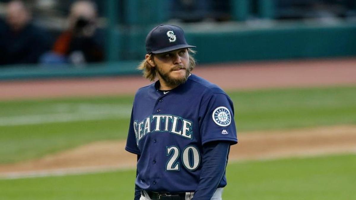 Seattle Mariners starting pitcher Wade Miley walks to the dugout in the fourth inning of a baseball game against the Cleveland Indians Tuesday, April 19, 2016, in Cleveland. Miley pitched 3 2/3 innings and gave up nine hits and three runs.