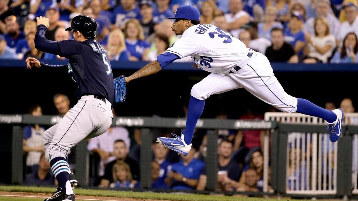 
Royals starting pitcher Yordano Ventura tags out the Mariners’ Brad Miller (5) along the first base line after Miller grounded to Ventura during the third inning Wednesday night in Kansas City, Mo.
