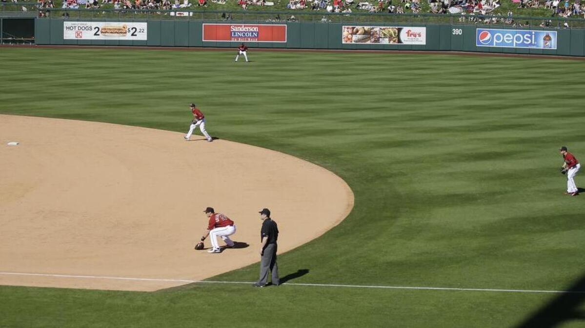 Diamondbacks shortstop Nick Ahmed, second baseman Brandon Drury, right, and first baseman Paul Goldschmidt, near, overload one side of the infield against Oakland during a spring training game in Scottsdale, Ariz. The defensive shift, while not particularly fan-friendly, is gaining popularity.
