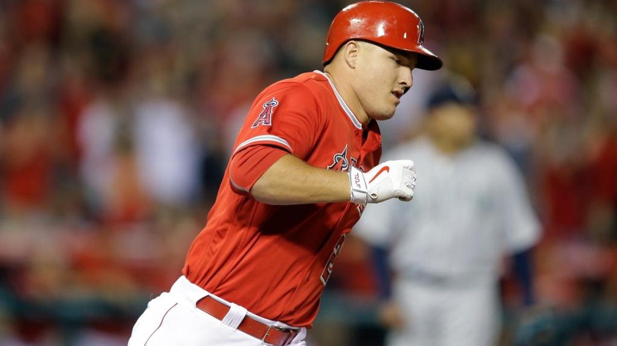 Los Angeles Angels' Mike Trout rounds the bases after hitting a two-run home run during the sixth inning of a baseball game against the Seattle Mariners, Saturday, April 23, 2016, in Anaheim, Calif.