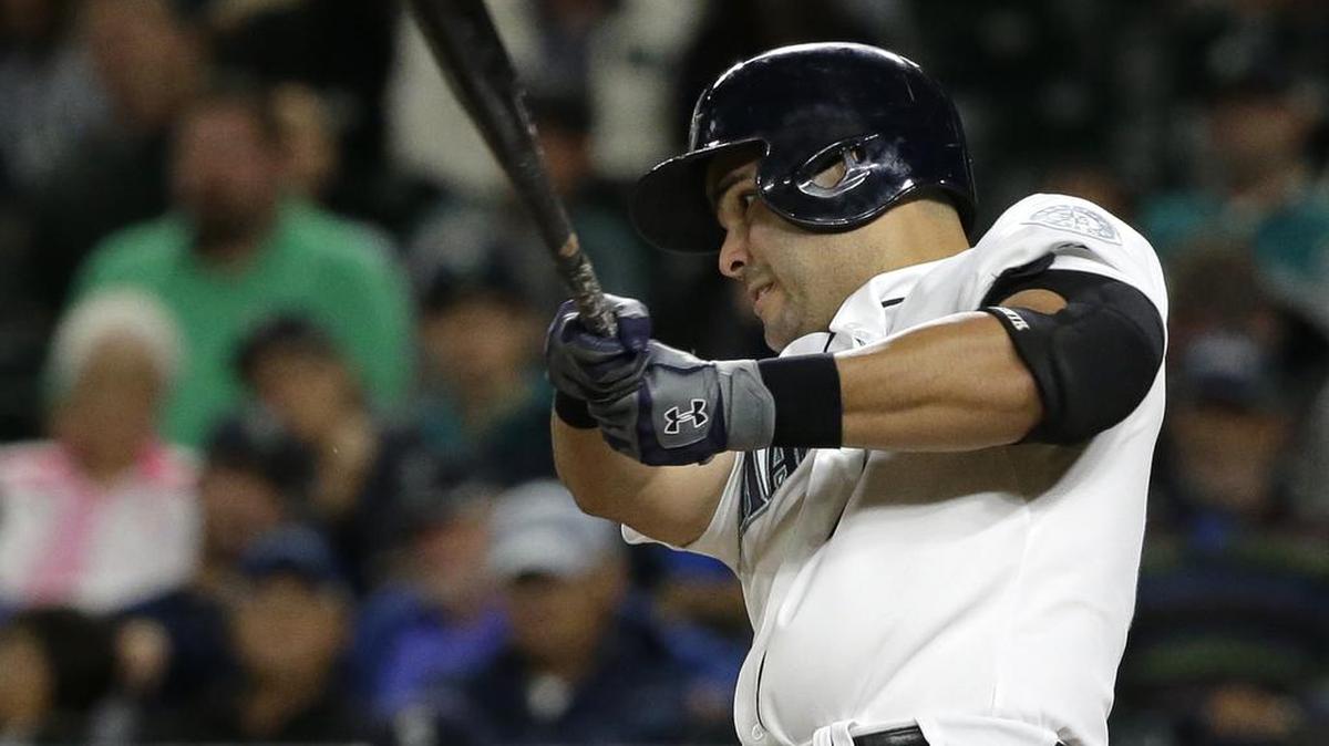 
Jesus Montero of the Mariners hits a three-run homer against the Angels on Wednesday at Safeco Field.
