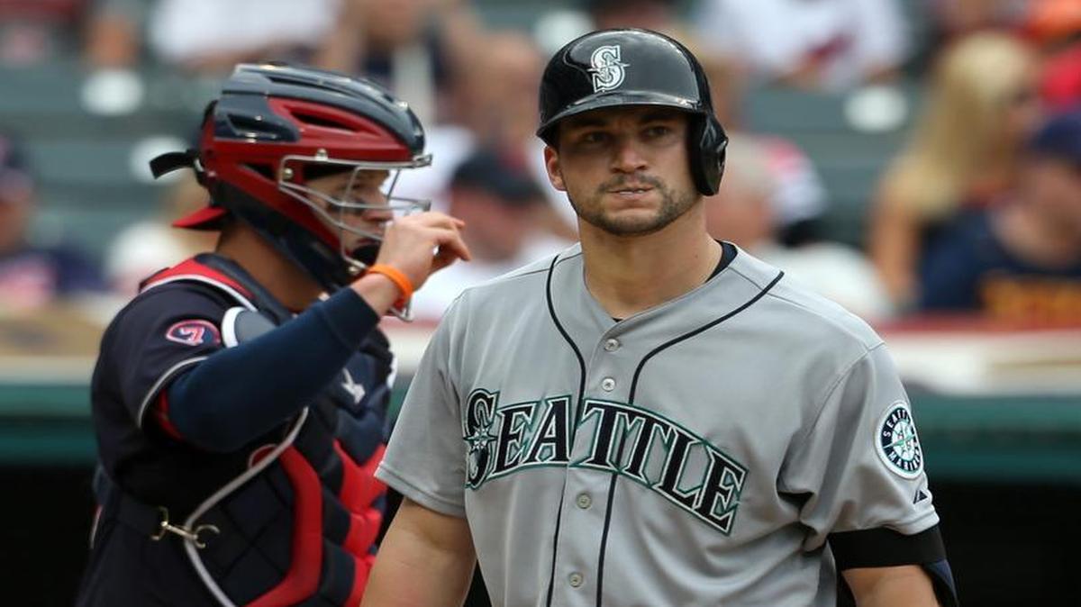 
Seattle’s Mike Zunino heads toward the dugout after striking out during the eighth inning in a 6-0 loss to Cleveland on Thursday. Indians catcher Roberto Perez is behind Zunino.
