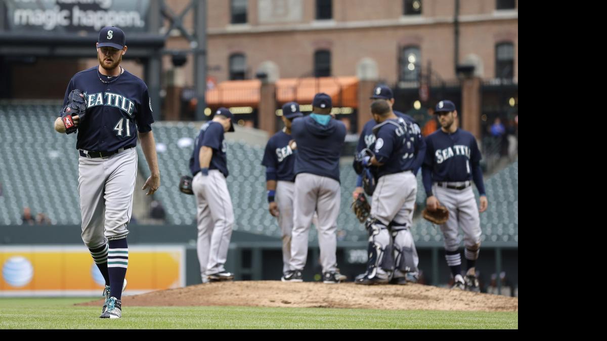 
Seattle Mariners relief pitcher Charlie Furbush walks off the field after being relieved in the seventh inning of a baseball game against the Baltimore Orioles, Thursday, May 21, 2015, in Baltimore. Baltimore won 5-4.
