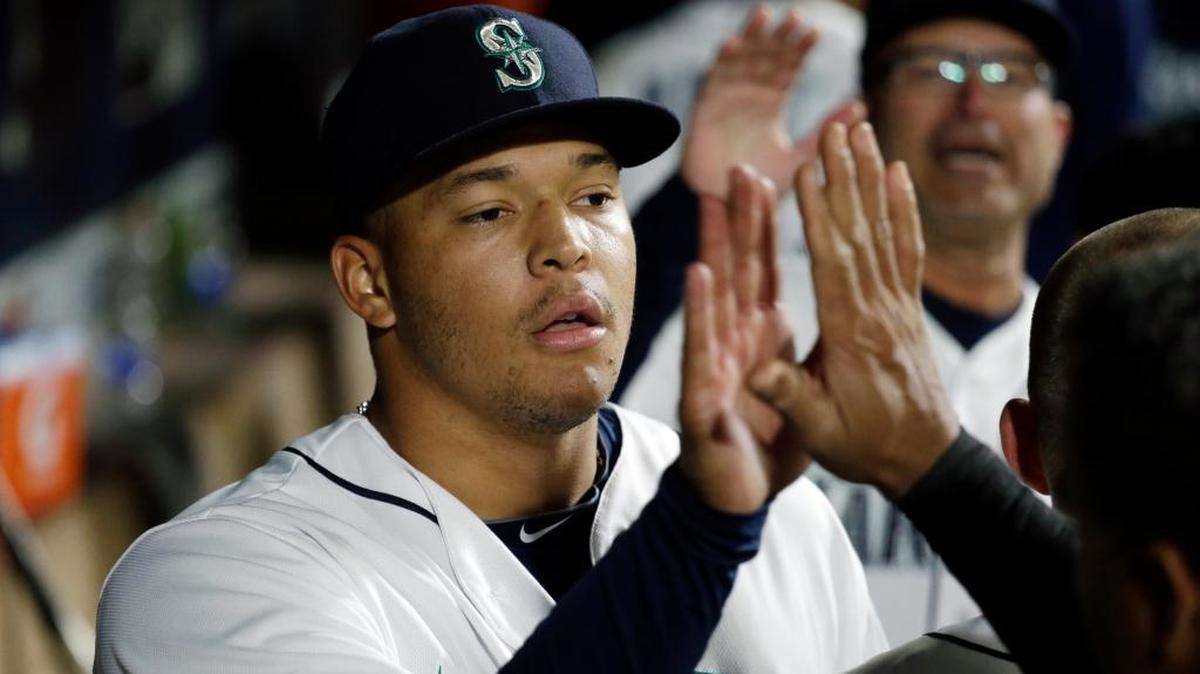 Seattle Mariners starting pitcher Taijuan Walker is congratulated on his performance after coming out against the Houston Astros in a baseball game Monday, April 25, 2016, in Seattle.