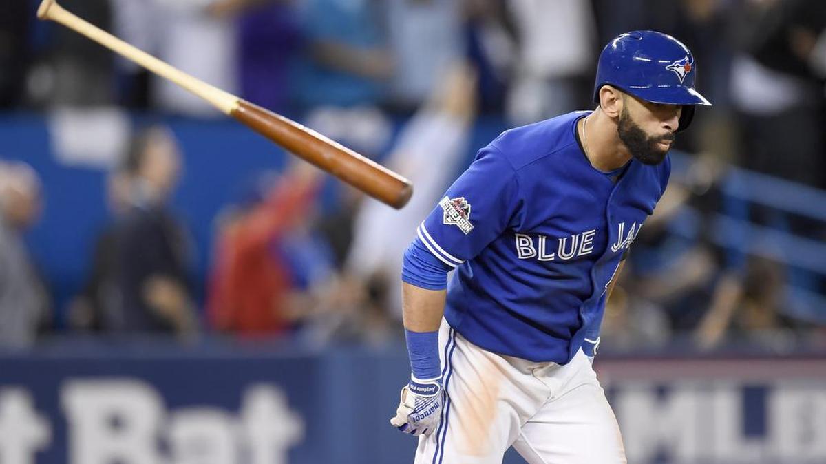 
Toronto’s Jose Bautista flips his bat after hitting a three-run home run Wednesday during the seventh inning to put the Blue Jays up 6-3 in Game 5 of the American League Division Series. 
