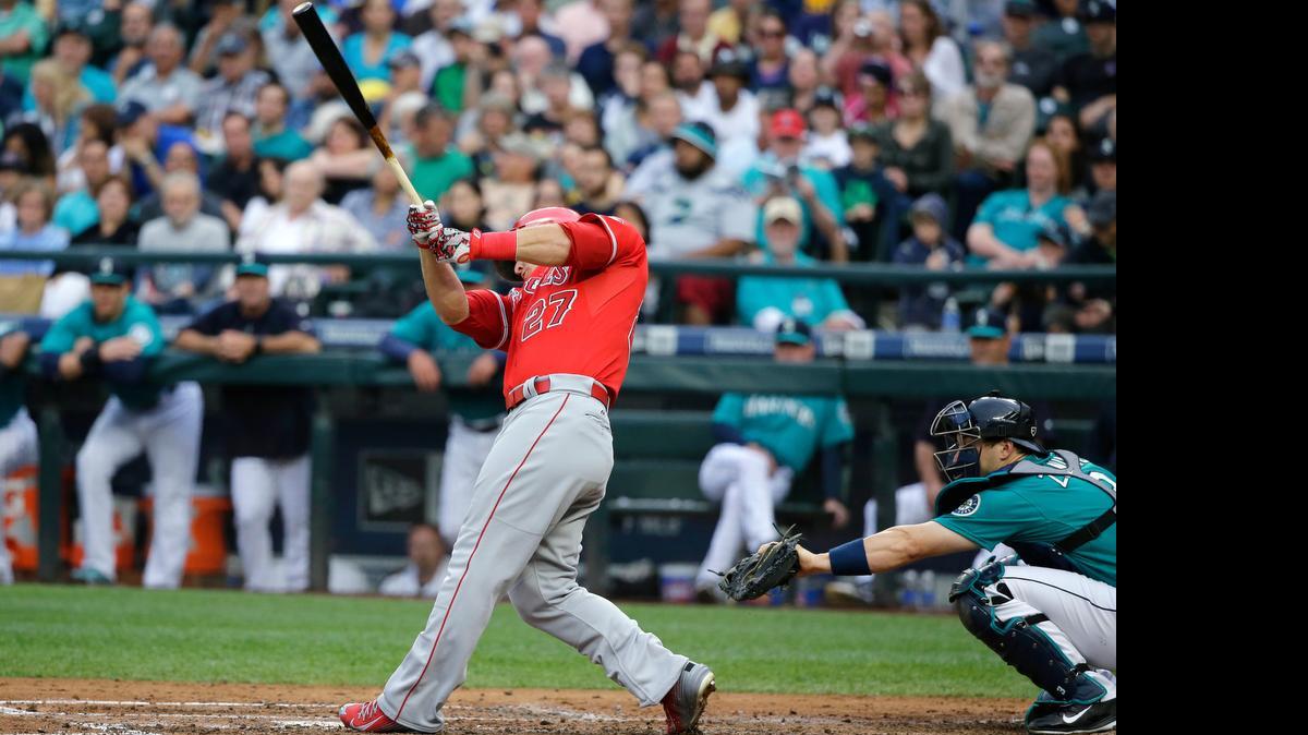 Mike Trout of the Angels connects on a three-run homer off the Mariners’ Mike Montgomery in the third inning Friday at Safeco Field.