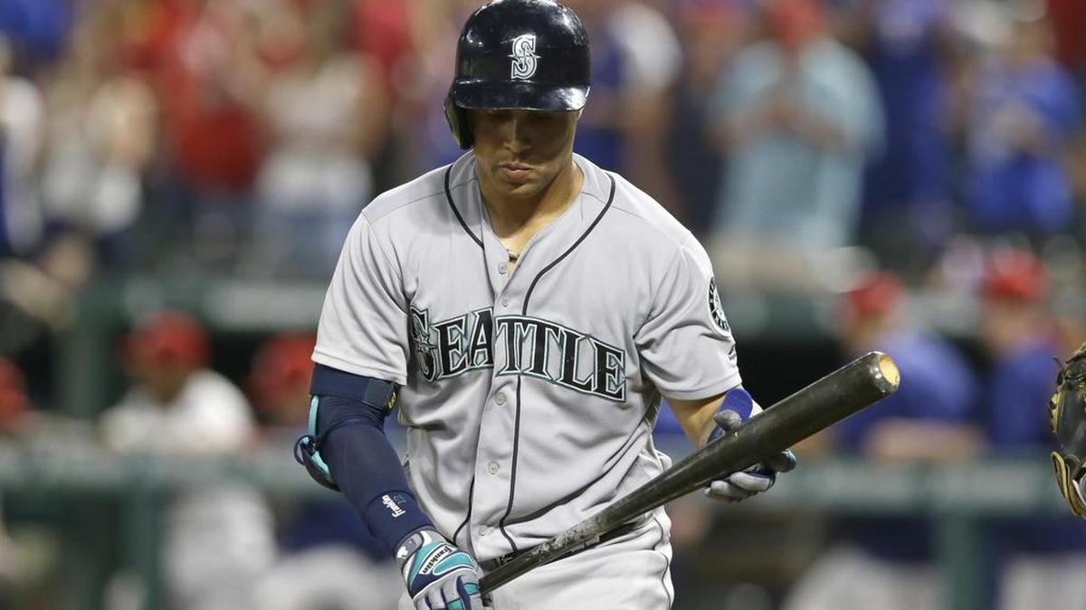 Leonys Martin heads off the field after striking out for the final out. The Mariners have lost six of seven and face a crowded wild-card race.