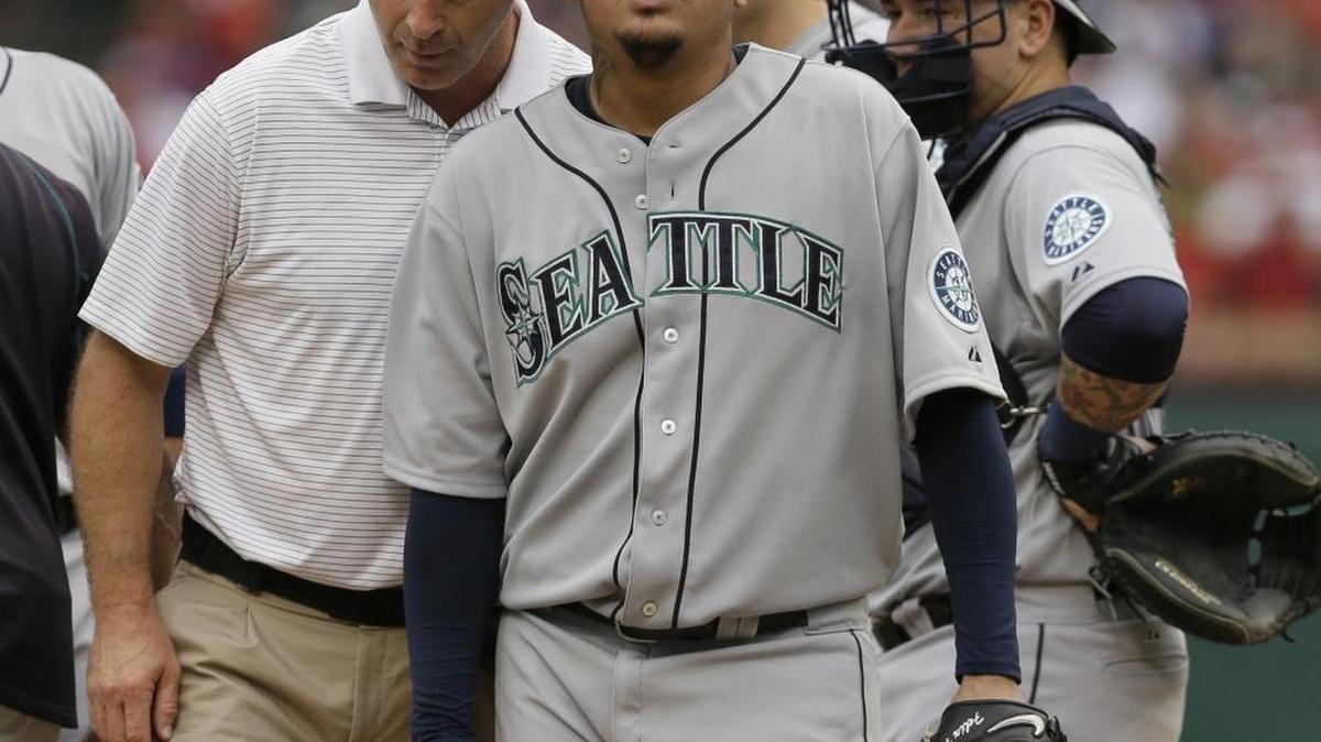 
Stiffness in his pitching elbow is one of the contributing factors that led to the Seattle Mariners shutting down starting pitcher Felix Hernandez, right.
