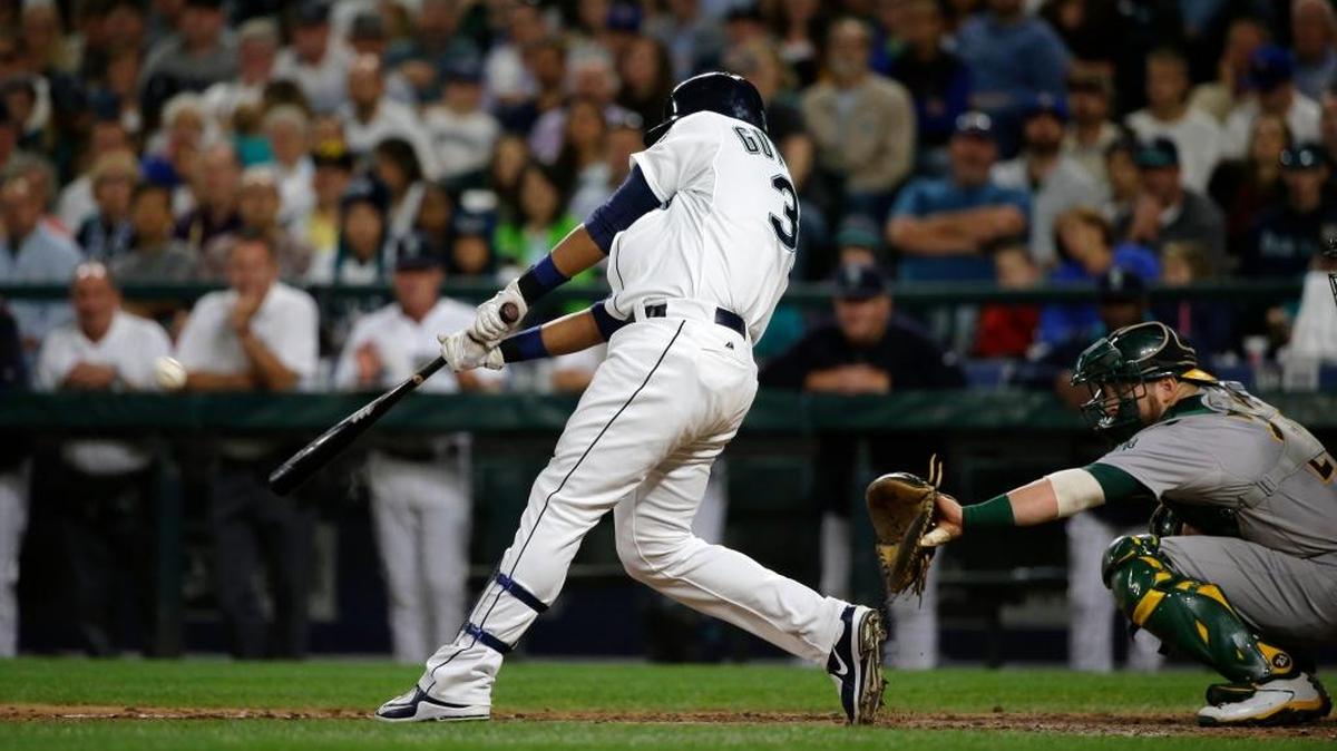 
Seattle’s Franklin Gutierrez hits a three-run home run in the third inning against the Oakland Athletics at Safeco Field on Monday night.
