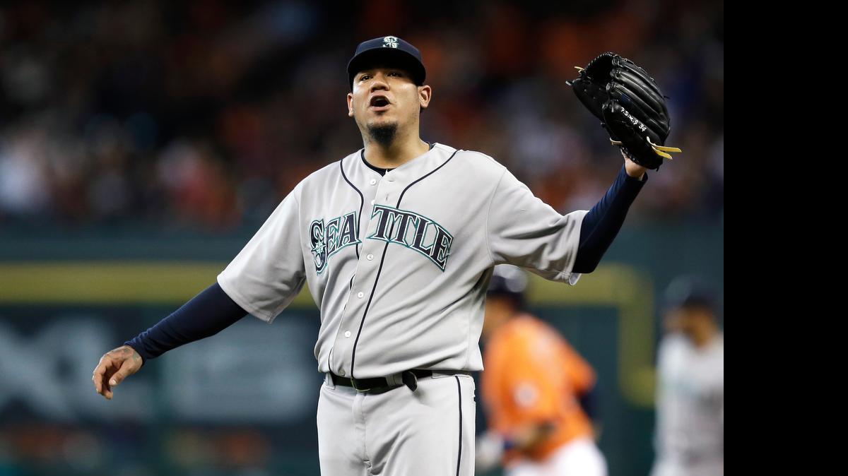 
Seattle Mariners starting pitcher Felix Hernandez allowed a two-run homer to Jason Castro of the Astros, background, in the first inning Friday in Houston.
