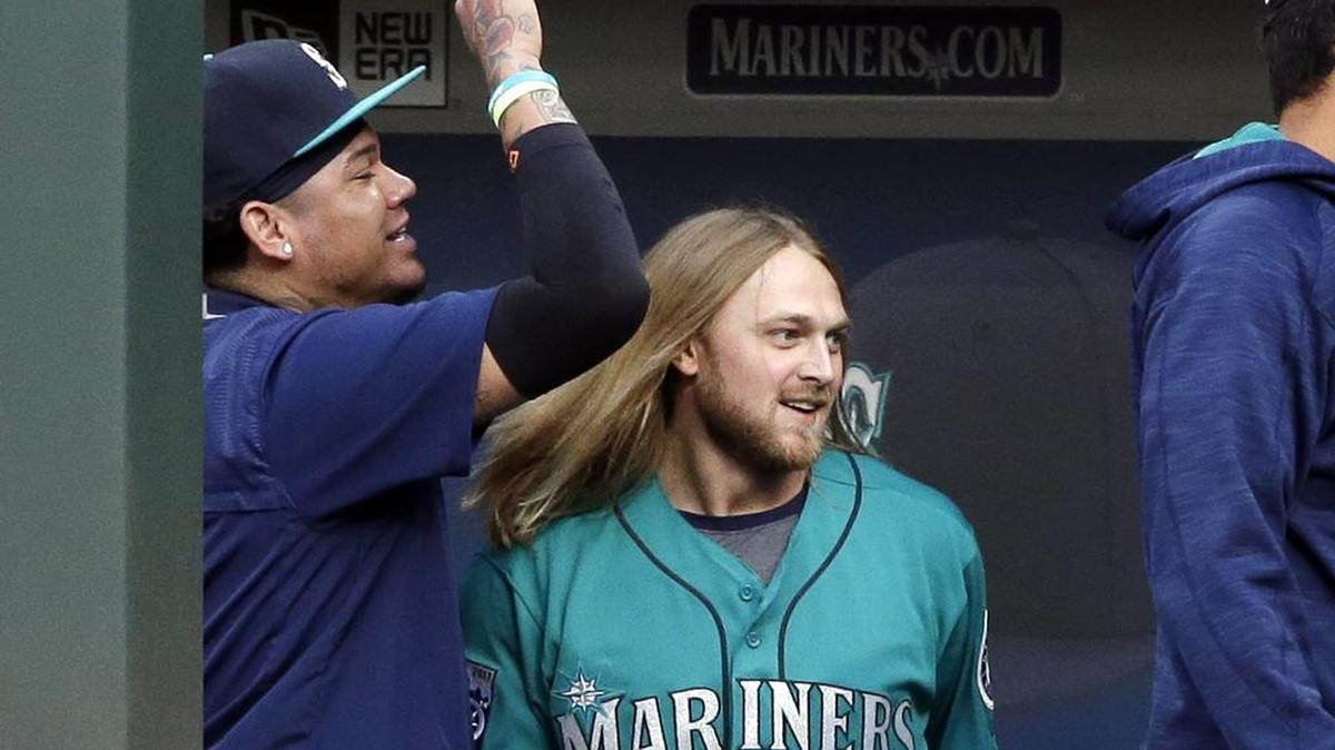 Taylor Motter was all smiles after getting congratulations from Felix Hernandez and others following his grand slam in the first inning.
