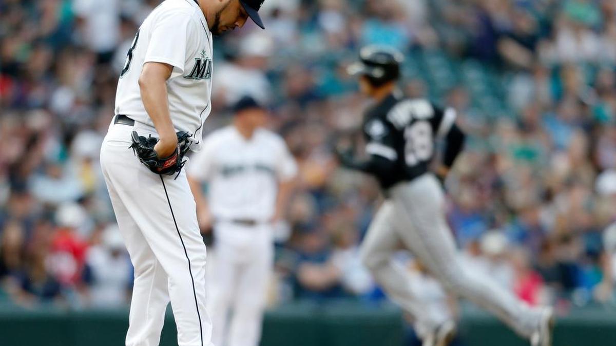 
Mariners pitcher Vidal Nuno looks down as Chicago’s Trayce Thompson rounds third base after hitting a solo home run Saturday.
