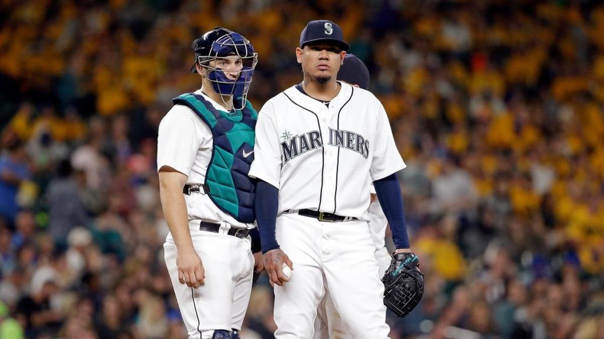 Seattle Mariners starting pitcher Felix Hernandez, right, waits with catcher Mike Zunino before Hernandez was pulled from the baseball game against the Houston Astros in the fifth inning Friday, Sept. 16, 2016, in Seattle. Hernandez allowed six runs (five earned) in 4 1/3 innings.