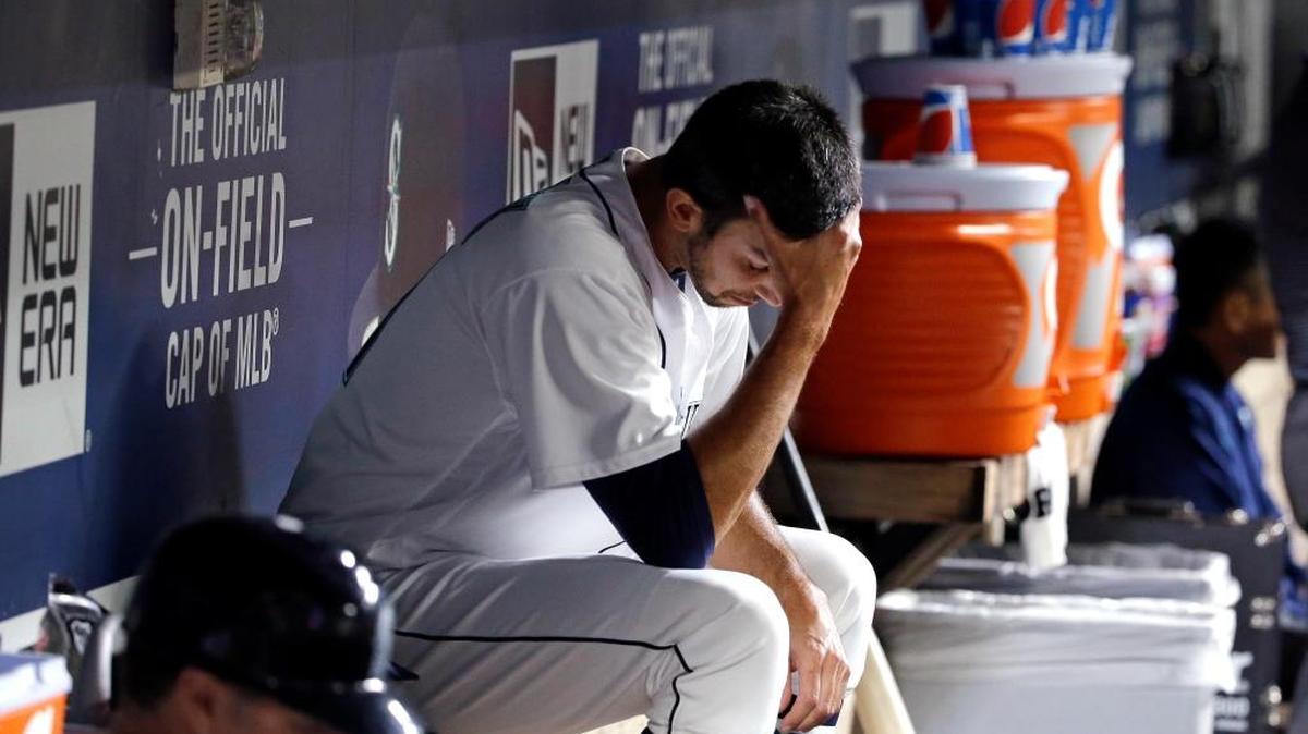 Mariners closer Steve Cishek sits in the dugout after giving up the go-ahead home run to the Red Sox’s Mookie Betts in the ninth inning Monday. He also blew a save Sunday.