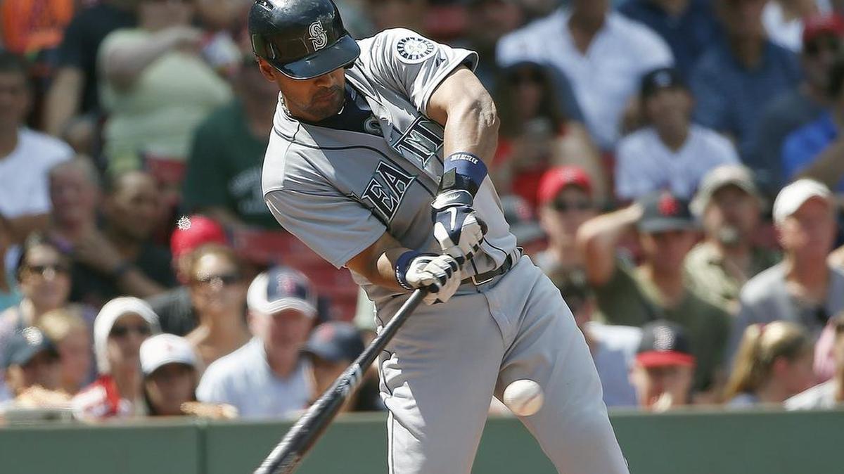 
Franklin Gutierrez of the Mariners hits a three-run home run in the third inning Sunday at Boston. He is batting .313 with seven homers and 18 RBIs in 31 games since his June 24 arrival from Triple-A Tacoma.
