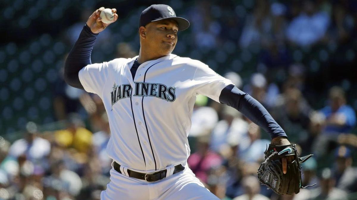 Seattle Mariners starting pitcher Taijuan Walker throws against the Tampa Bay Rays in the first inning Wednesday. Walker threw five shutout innings before allowing a grand slam.