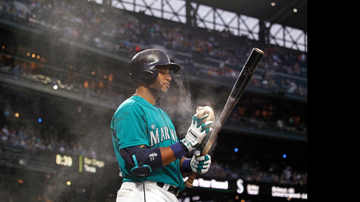 
Seattle Mariners' Robinson Cano uses rosin on his bat during a baseball game against the Los Angeles Angles on Friday, July 10, 2015, in Seattle.
