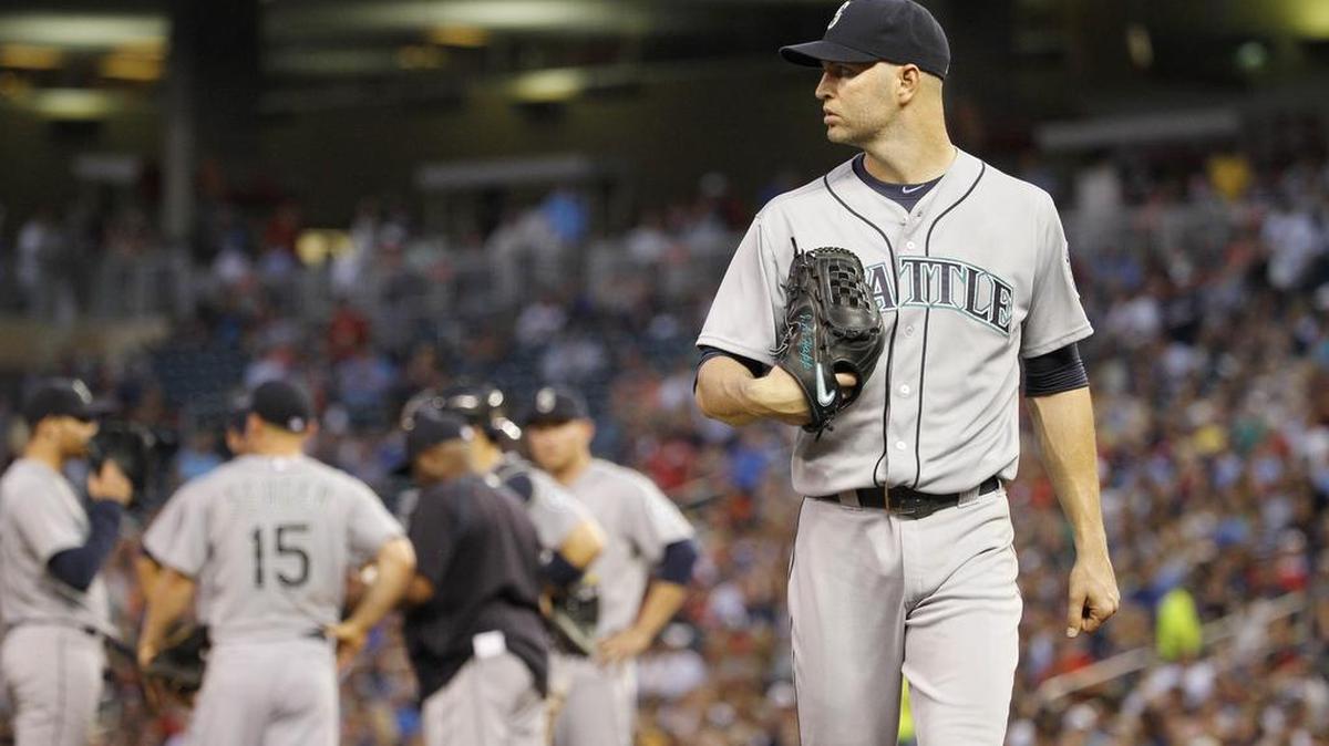 
Mariners pitcher J.A. Happ leaves the mound after getting pulled in the fourth inning Thursday. Happ gave up seven runs on nine hits in 3
1/3 innings. The Twins won the game, 9-5.
