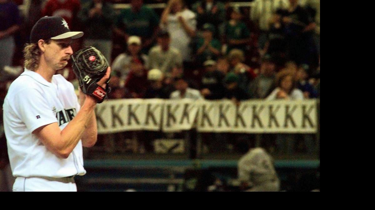 
Mariners starting pitcher Randy Johnson prepares to deliver a pitch against the Tampa Bay Devil Rays in the bottom of the ninth inning Sunday, May 24, 1998 in Seattle as the line of 'K's' behind him grows. Johnson struckout 15 in the Mariners 3-1 victory. (AP Photo/Elaine Thompson)
