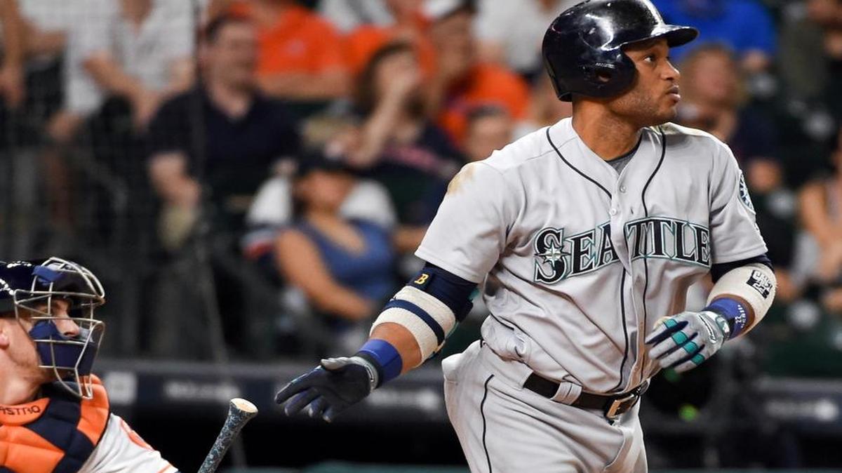 Seattle Mariners’ Robinson Cano watches his three-run double in the ninth inning of a baseball game against the Houston Astros, Thursday, May 5, 2016, in Houston.