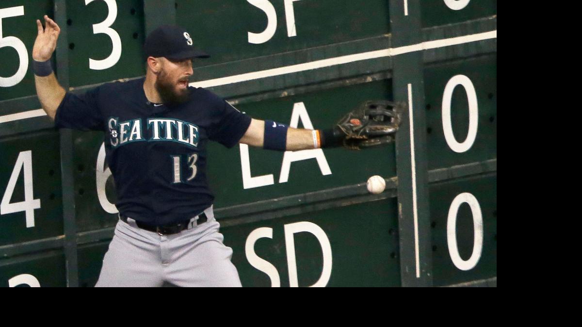Seattle Mariners left fielder Dustin Ackley can't get his glove on the ball giving Houston Astros' Preston Tucker an RBI double in the eighth inning of a baseball game, Sunday, June 14, 2015, in Houston. The Astros won 13-0. (AP Photo/Pat Sullivan)
