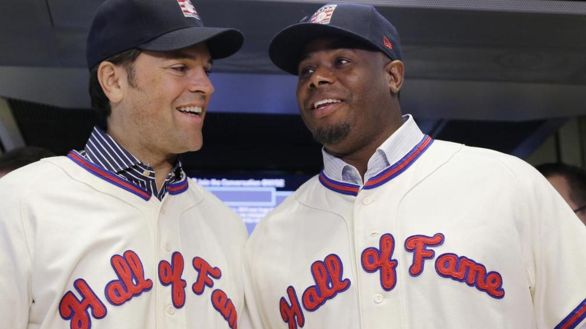 Baseball Hall of Fame inductees Mike Piazza, left, and Ken Griffey Jr. pose for photographers at the New York Stock Exchange in honor of their election to the National Baseball Hall of Fame.