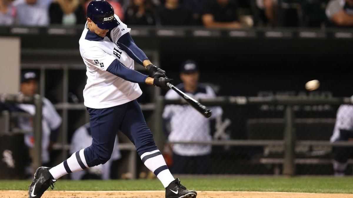 
Trayce Thompson of the White Sox drives in a run with a double in the third inning against the Seattle Mariners at U.S. Cellular Field in Chicago on Thursday. Thompson is the younger brother of former Washington State and current Golden State Warriors basketball star Klay Thompson. The White Sox wore throwback uniforms for the game.
