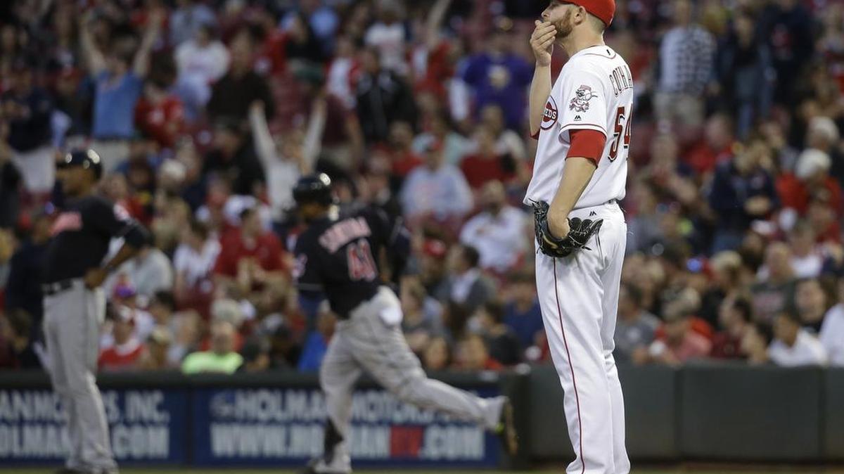 Cincinnati pitcher Caleb Cotham (54) reacts after giving up a two-run home run to Cleveland’s Carlos Santana, center rear, during the fifth inning Thursday. The Reds bullpen is ranked No. 30, among 30 teams, in virtually every pitching category.