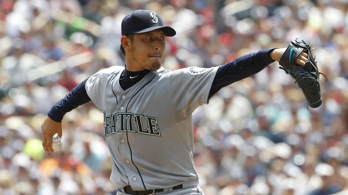 Seattle Mariners starting pitcher Hisashi Iwakuma delivers to the Minnesota Twins during the first inning of a baseball game in Minneapolis, Sunday, Aug. 2, 2015.