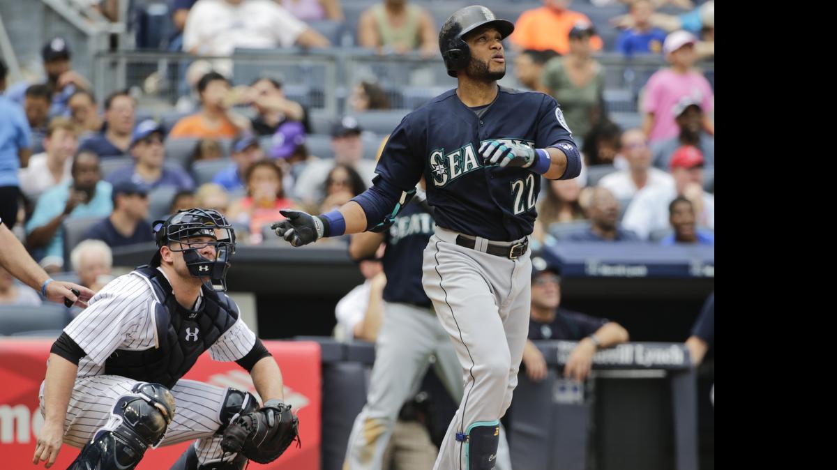 
Seattle Mariners' Robinson Cano (22), right, and New York Yankees catcher Brian McCann watch a ball hit by Cano for a two run home run during the sixth inning of a baseball game Saturday, July 18, 2015, in New York.

