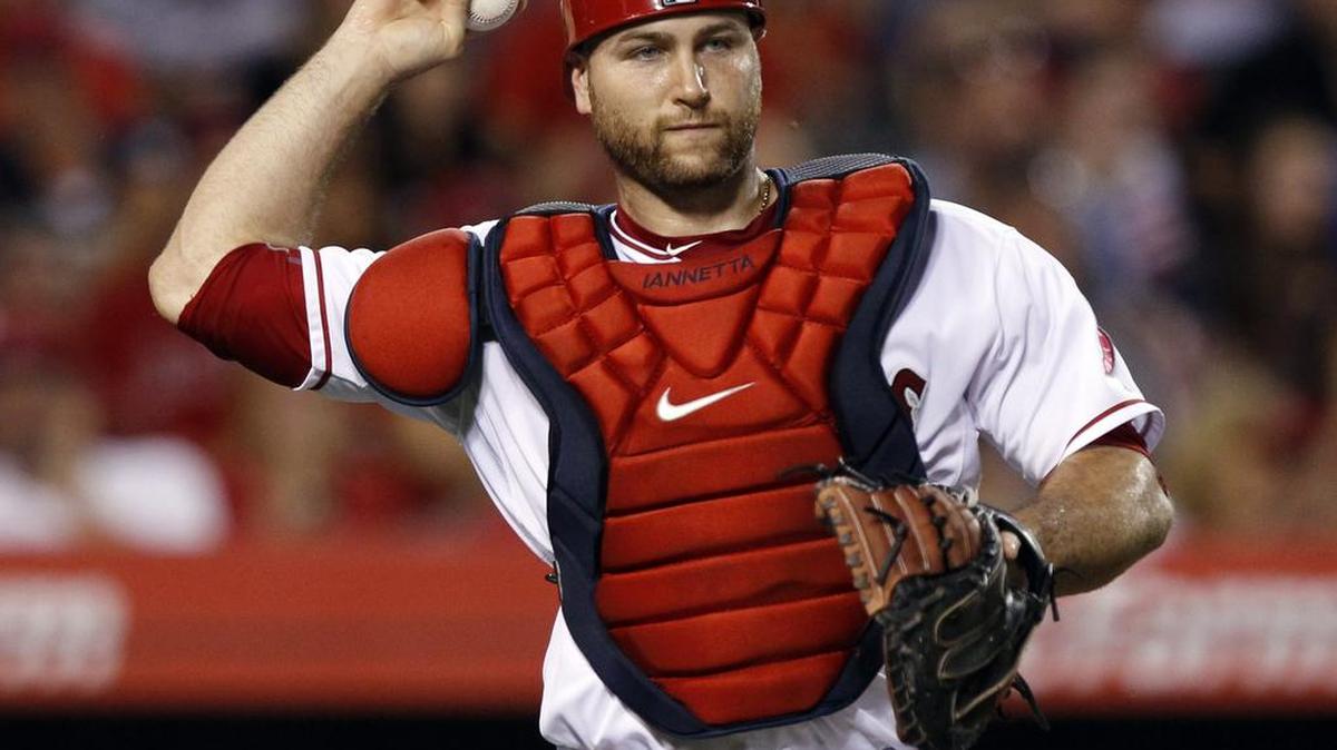 In this July 21 file photo, Los Angeles Angels catcher Chris Iannetta throws out Minnesota Twins' Trevor Plouffe in Anaheim, Calif. Iannetta signed a one-year contract with the Mariners on Monday, Nov. 23, with the expectation he will be Seattle’s starting catcher heading into 2016.