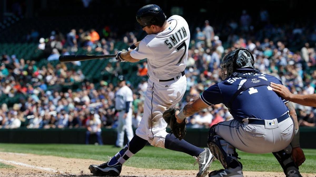 Seattle Mariners’ Seth Smith hits a solo home run as San Diego Padres catcher Christian Bethancourt looks on in the fifth inning of a baseball game, Tuesday, May 31, 2016, in Seattle. It was Smith’s second home run of the game.