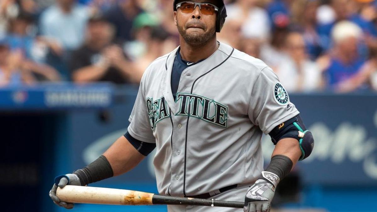 Nelson Cruz walks back to the dugout after striking out in the fourth, when the Mariners mounted their only significant threat against Blue Jays starter J.A. Happ, who gave up just one hit in six shutout innings.