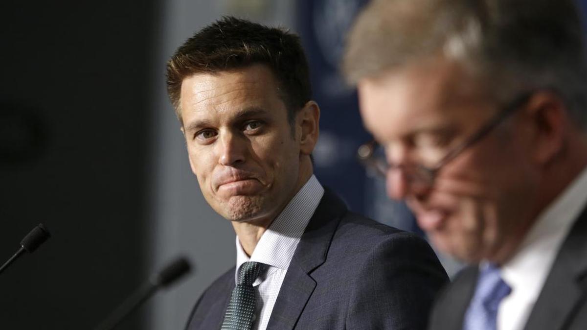
New Seattle Mariners general manager Jerry Dipoto, left, looks on as team president Kevin Mather speaks at a news conference Sept. 29 in Seattle. Dipoto has retained some of the previous front-office staff he inherited when he was hired for the GM position. 

