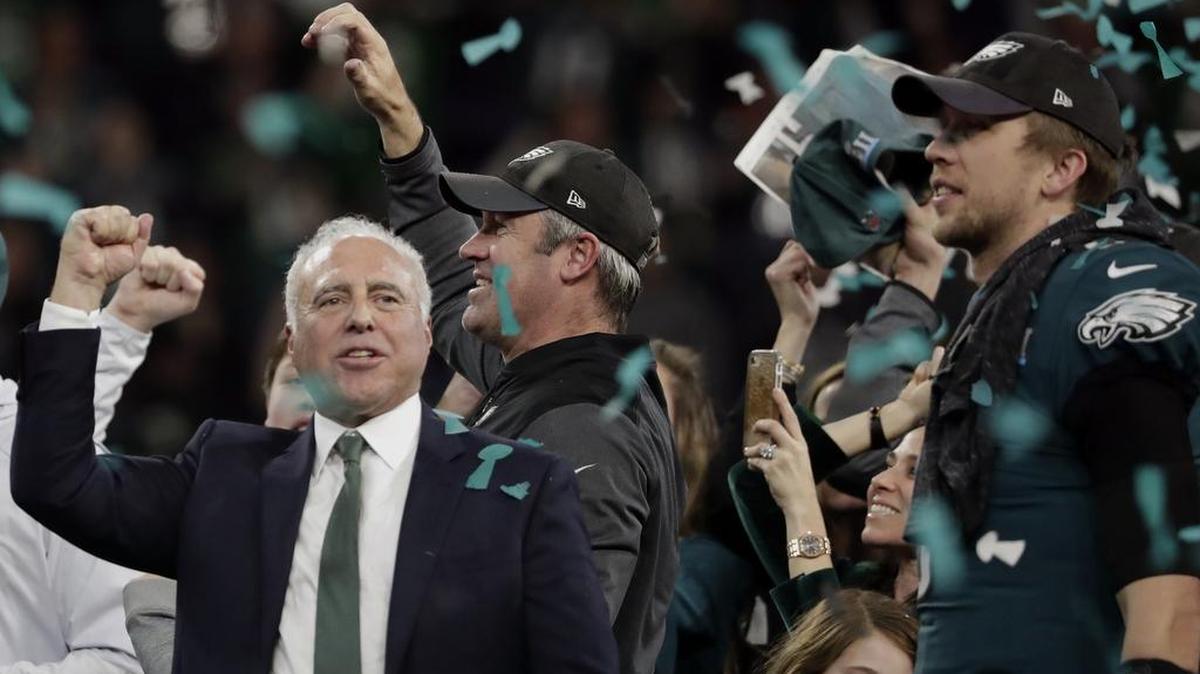 Philadelphia Eagles owner Jeffrey Lurie, left, head coach Doug Pederson and quarterback Nick Foles celebrate after winning the NFL Super Bowl 52 football game against the New England Patriots, Sunday, Feb. 4, 2018, in Minneapolis. Lurie is one of the wealthiest residents of Pennsylvania, Forbes reported in its annual billionaires list.