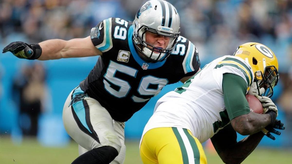 In this Nov. 8, 2015, file photo, Carolina Panthers' Luke Kuechly (59) moves in to to tackle Green Bay Packers' James Starks (44) during the second half of an NFL football game in Charlotte, N.C. Off from the field, Panthers safety Roman Harper says Kuechly is “the nicest guy you ever want to meet.” But when Kuechly hits the field, teammates say he changes into a person you wouldn’t recognize, ferocious, fiery and competitive.