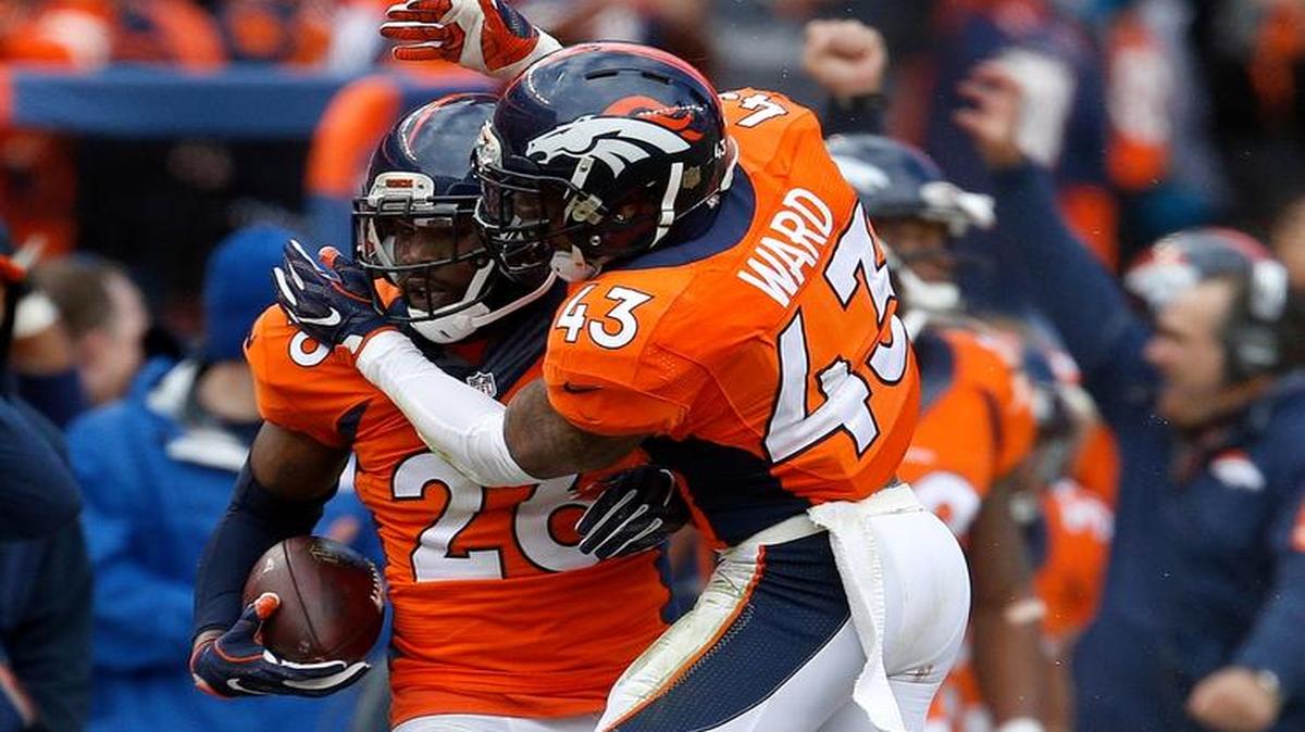 Denver Broncos free safety Darian Stewart (26) is congratulated by teammate T.J. Ward after intercepting a pass from New England Patriots quarterback Tom Brady during the first half the NFL football AFC Championship game between the Denver Broncos and the New England Patriots, Sunday, Jan. 24, 2016, in Denver.