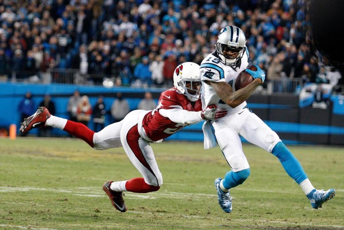 Carolina Panthers' Ted Ginn gets past Arizona Cardinals' Justin Bethel for a touchdown run during the first half the NFL football NFC Championship game Sunday, Jan. 24, 2016, in Charlotte, N.C. (AP Photo/Bob Leverone)