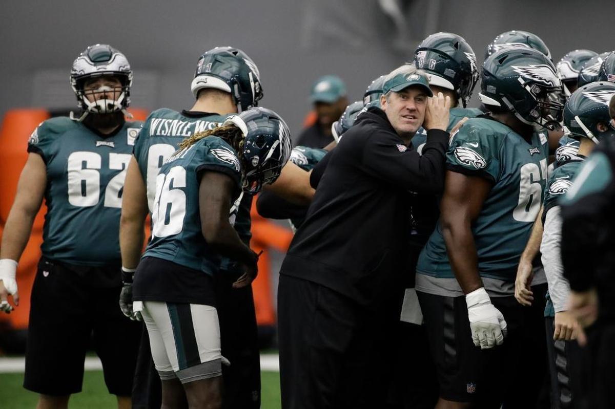 Philadelphia Eagles head coach Doug Pederson huddles with the team during practice at the team's training facility Jan. 26 in Philadelphia.