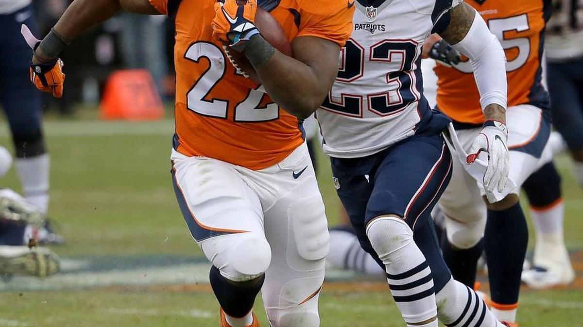 Denver Broncos RB C.J. Anderson (22) rushes against the New England Patriots during the AFC Championship on Sunday, Jan. 24, in Denver.