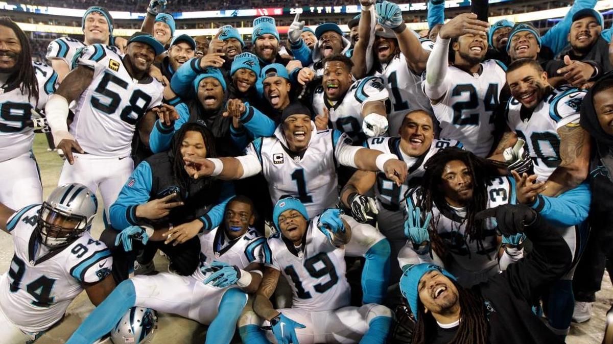 Some Carolina Panthers celebrate from the bench during the second half the NFL football NFC Championship game against the Arizona Cardinals, Sunday, Jan. 24, 2016, in Charlotte, N.C. (AP Photo/Chuck Burton)
