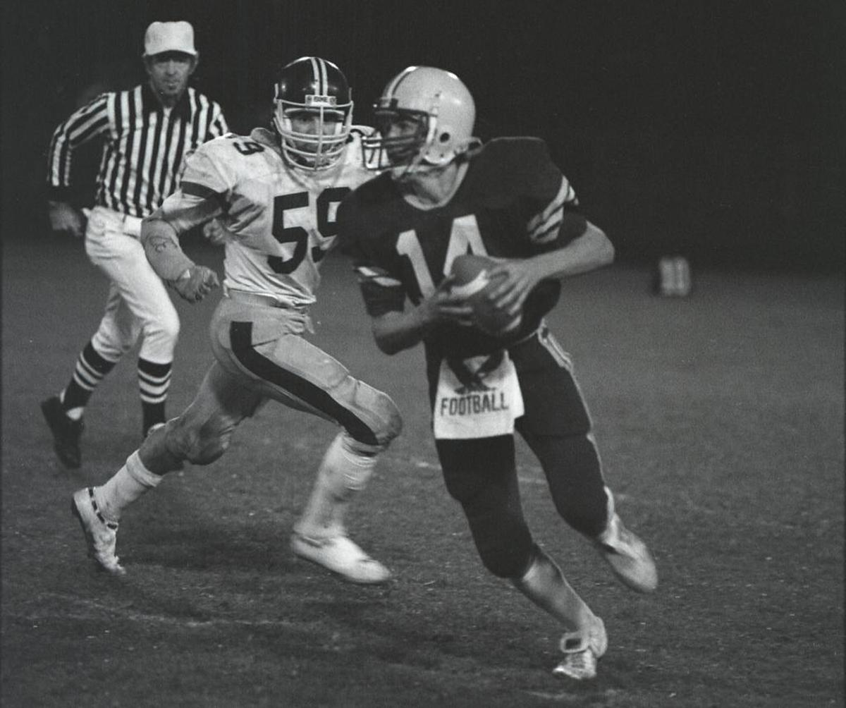 Former Ferndale quarterback Doug Peterson looks for running room during a 1984 game against Sehome. Peterson is now the coach of the Philadelphia Eagles and leads the team into Super Bowl XLII Sunday in Minneapolis.