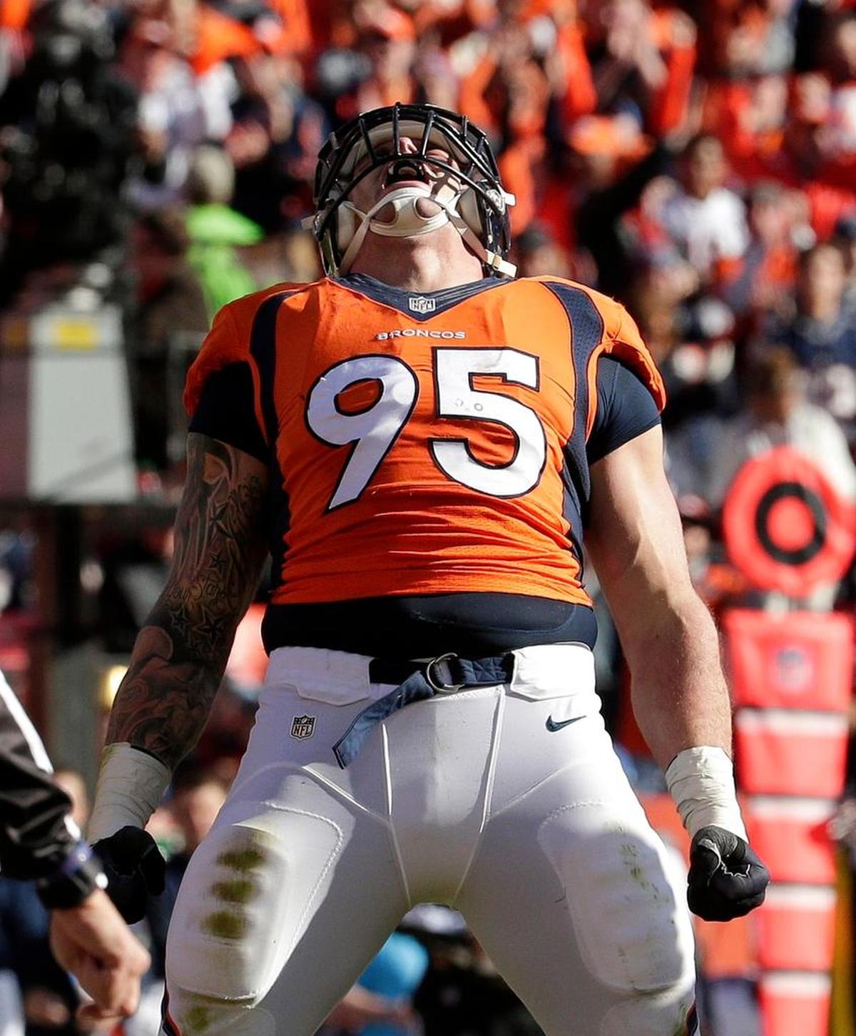 Denver Broncos defensive end Derek Wolfe (95) celebrates after sacking New England Patriots quarterback Tom Brady during the first half the NFL football AFC Championship game between the Denver Broncos and the New England Patriots, Sunday, Jan. 24, 2016, in Denver.