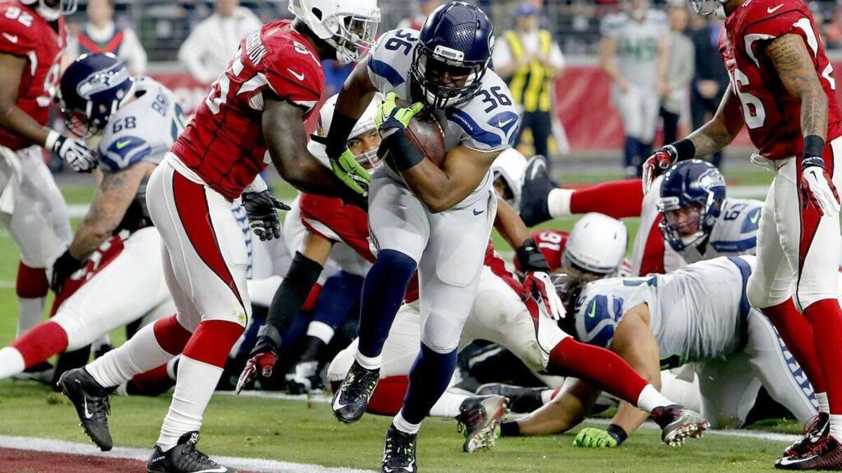 Seattle running back Bryce Brown (36) scores a touchdown in the first half against Arizona Sunday. The Seahawks’ offensive line opened run lanes all game.
