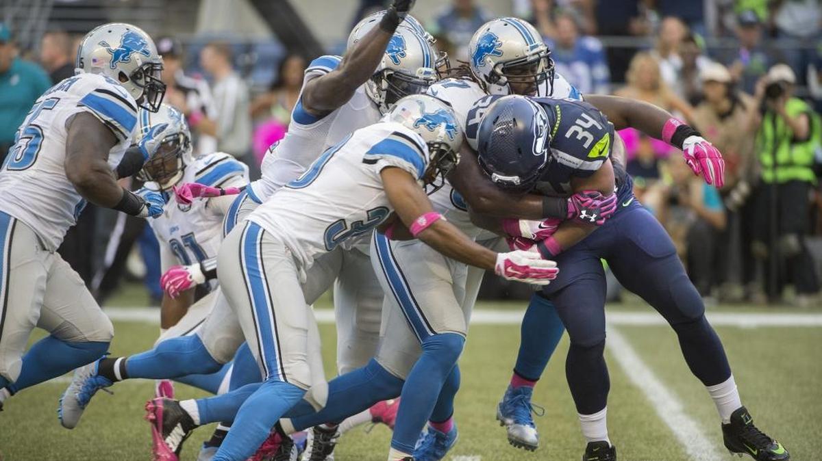 
There wasn’t much running room for Seahawks running back Thomas Rawls (34), who was often engulfed by a multitude of Lions defenders whenever he touched the ball Monday night at CenturyLink Field.
