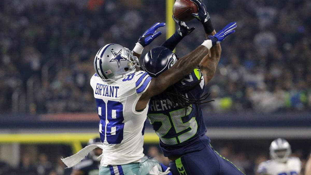 Seattle’s Richard Sherman (25) tries for an interception on a pass intended for Dallas receiver Dez Bryant. Sherman held Bryant to 2 catches for 12 yards.