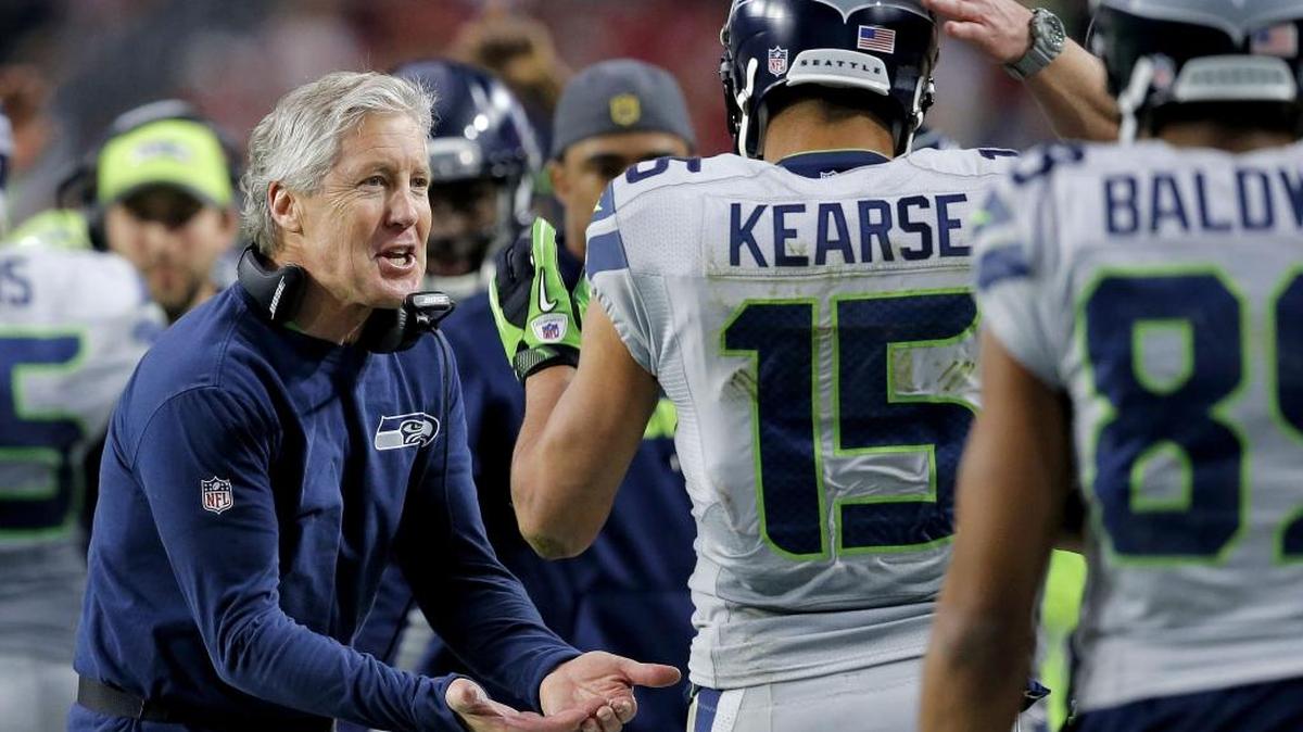 Pete Carroll greeting Seahawks wide receiver Jermaine Kearse, who grew up on Fort Lewis as a son of Army SFC David Kearse, in the regular-season finale at Arizona. Carroll parallels his leadership and training of the Seahawks to how the Army’s Special Forces units lead and train -- specifically the 1st Special Forces Group at Joint Base Lewis-McChord.