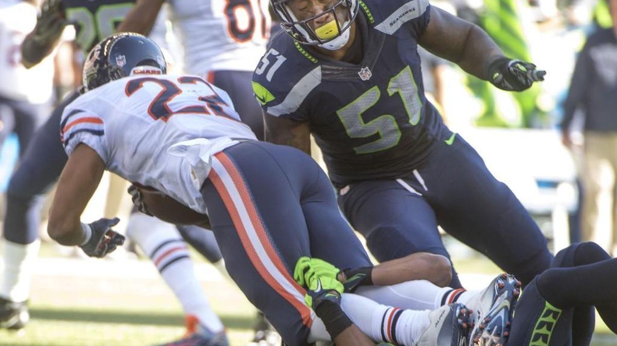 Seahawks linebacker Bruce Irvin converges on Chicago’s Matt Forte as Earl Thomas brings him down. Irvin is reportedly leaving Seattle for the Oakland Raiders when free agency opens Wednesday at 1 p.m.