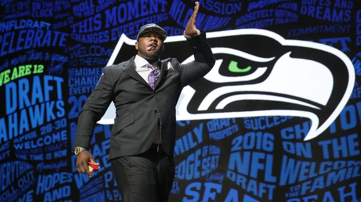 Alabama’s Jarran Reed celebrates after being selected by the Seattle Seahawks as the 49th pick in the second round of the 2016 NFL football draft, Friday, April 29, 2016, in Chicago.
